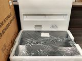 a white toilet that is sitting in the middle of a box
