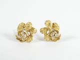 a pair of gold and diamond earrings