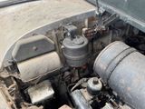 an old car engine with a lot of rust on it