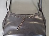 grey leather purse with a zipper on the front and handle