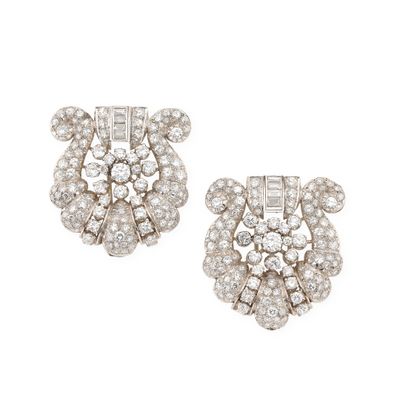 a pair of diamond and white gold earrings