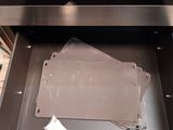 an open oven with a lot of papers inside of it