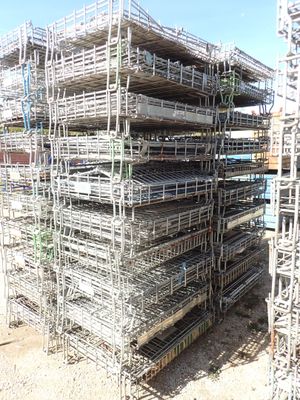 a large pile of scaffolding in the middle of a construction site