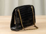 black croc embossed leather clutch bag with gold chain strap