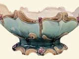 a blue and white bowl with a flower decoration on it