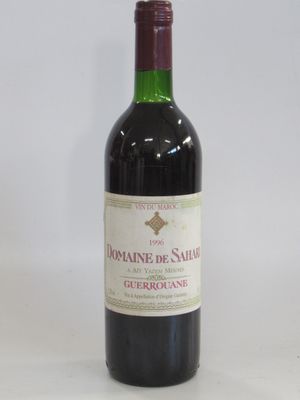 a bottle of wine that is sitting on a table