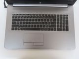 a laptop computer sitting on top of a white table