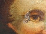 an old painting of a woman with a tear on her forehead