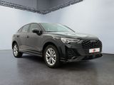 a grey 2020 hyundai kona is parked in a garage