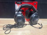 a pair of headphones sitting on top of a wooden table