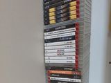 a stack of dvds on a shelf in a room