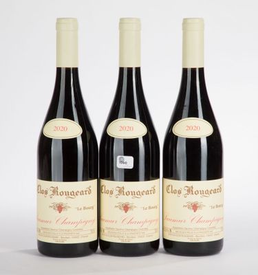 three bottles of red wine sitting next to each other on a white surface