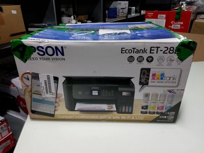 a box with a printer on it sitting on a table