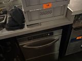 a kitchen with a dishwasher and a dishwasher on the counter