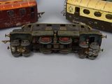 three toy trains sitting next to each other on a table