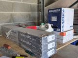 a pile of boxes sitting on a table in a garage