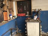 an image of a garage with tools on the counter