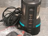 an image of a black and blue lantern sitting on top of a table