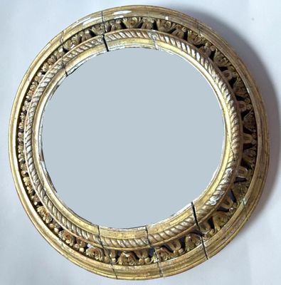 a mirror that is sitting on a white table