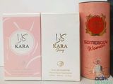 two boxes of perfume sitting on top of a table next to each other