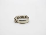 an image of a diamond ring on a white surface