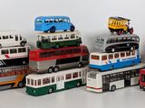 a lot of toy buses that are sitting on top of each other