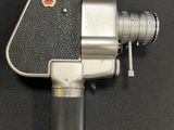 an image of an old movie camera on a black surface