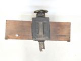 a picture of a wooden beam with a metal device attached to it