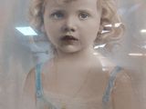 a picture of a little girl in a picture frame