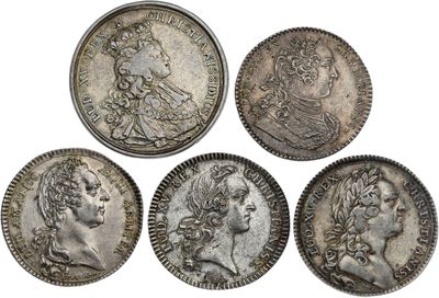 four roman silver coins, one of which has a bust and the other of which is a bust
