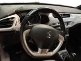 the interior of a car with a steering wheel and dashboard