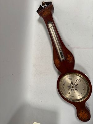 a wooden clock hanging on the wall next to a clock