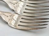 five forks that are sitting on top of each other
