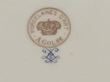 an image of a plate with a crown on it on a table