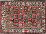 a red and black rug with a pattern on it