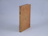 a small book that is sitting on a white surface