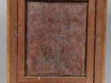 an old wooden easel with a painting on top of it