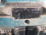 a close up of a motorcycle with a number plate on it