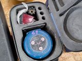 a case with a watch inside of it on a table