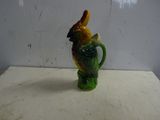 a figurine of a bird with a hat on it ' s head