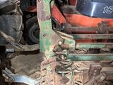 a machine that is sitting on the ground in a garage