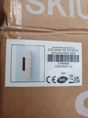 a box with a sticker on it that says sklue