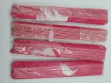 six pink paper straws are wrapped in plastic bags on a white surface
