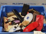 a blue bin filled with assorted items in it