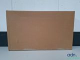 a cardboard box sitting on the floor next to a wall