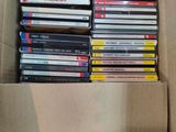 a cardboard box full of dvds in it