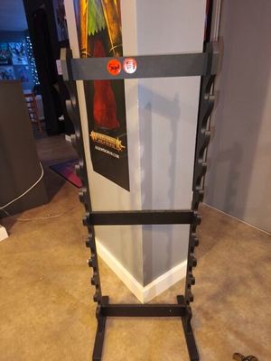 a picture of a gym equipment rack with a bar