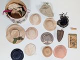 many hats and other items laid out on the table