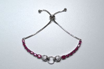 silver plated bracelet with pink beads and silver beads on a white background