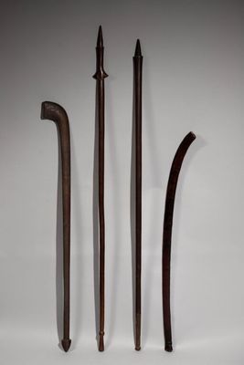 three different types of weapons are displayed on a white surface